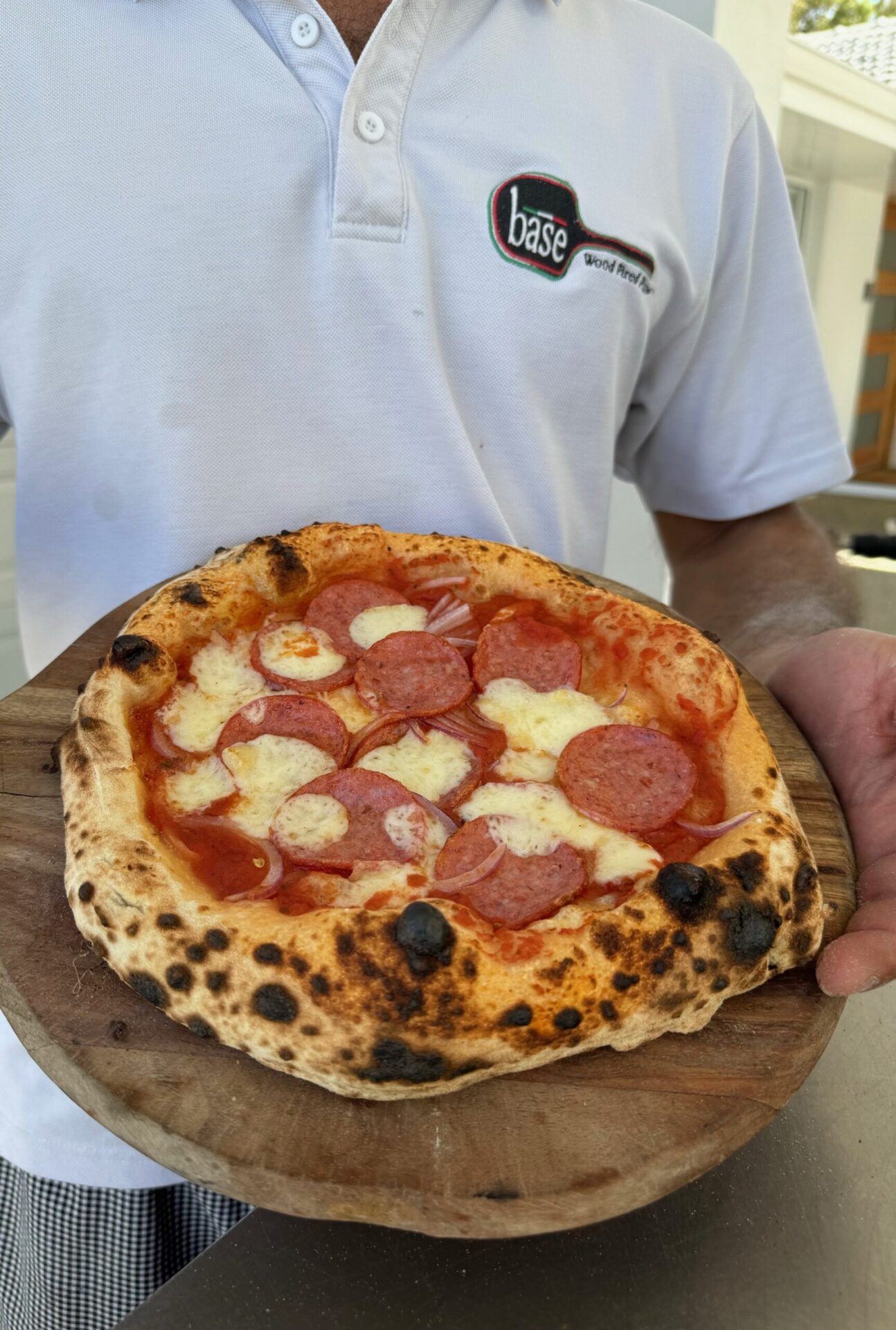 Owner Fabio with pizza